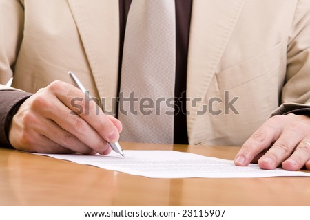 businessman signing some important documents (selective focus)