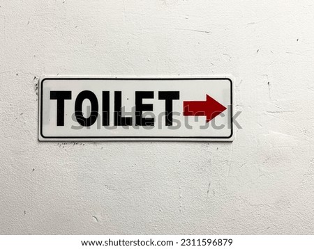 Toilet sign. Follow it and you will find the place.