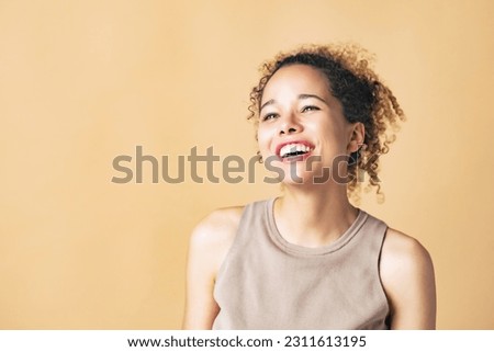 Beauty portrait of a black woman in a studio shot with beautiful lighting. Cosmetics and skin care concept. Royalty-Free Stock Photo #2311613195