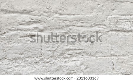 Textured wall in whitewash with limewash and plaster. Abstract background, texture, frame, pattern and copy space