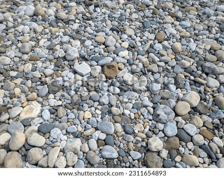 Small stone texture for background. High quality photo. Texture pattern of pebbles gravel and small stones in walk way path for garden interior decoration