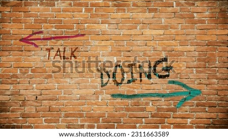 Street Sign the Direction Way to Doing versus Talk Royalty-Free Stock Photo #2311663589