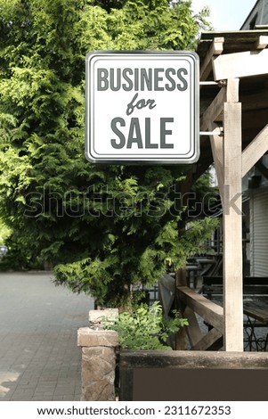 Building with sign Business For Sale outdoors