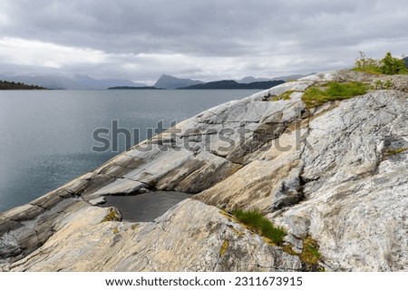 rock formations by the sea Royalty-Free Stock Photo #2311673915