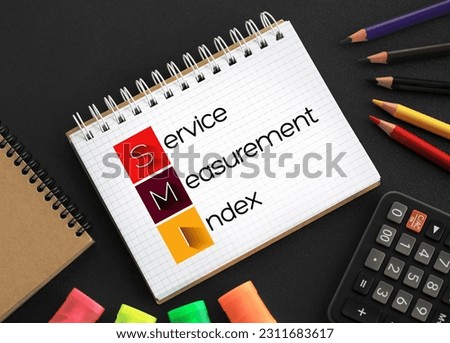 SMI - Service Measurement Index acronym on notepad, business concept background Royalty-Free Stock Photo #2311683617