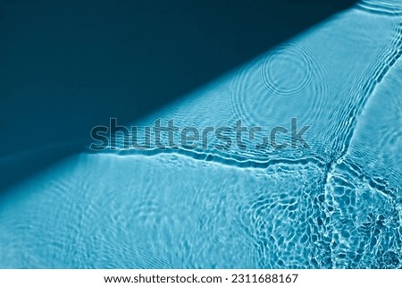 Transparent blue colored clear water surface texture with ripple