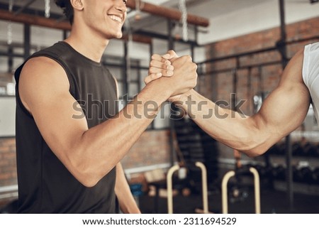 Training, handshake and people at a gym for fitness, agreement and deal on blurred background. Sport, friends and men shaking hands for healthy lifestyle commitment, goal and personal trainer support Royalty-Free Stock Photo #2311694529