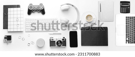 Big collage of modern devices with office stationery and cup of coffee on white background