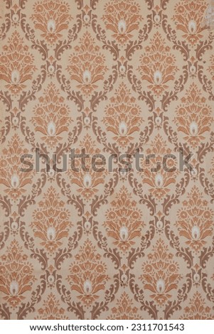 Old wallpaper on the wall. Old wallpaper for texture or background. Royalty-Free Stock Photo #2311701543