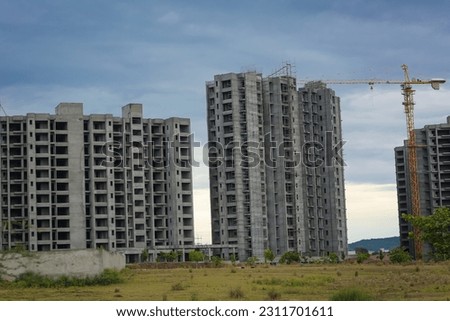 The building site is in the evening, construction Apartment Building , Gulburg Green Islamabad, Pakistan , cranes are working on  buildings.