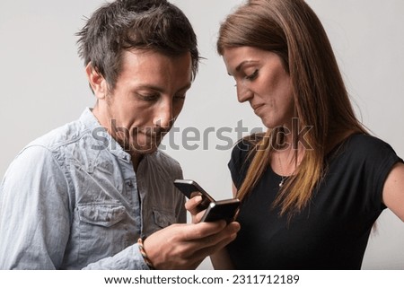 Despite their proximity, a man and woman ignore each other, absorbed in their phone screens. They lose the chance for meaningful dialogue and physical connection, existing merely as physical presences