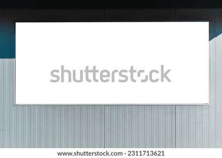 Blank mockup white poster billboard of store street showcase in a city at evening.Clear shop template.Signboard for logo presentation.Marketing and business concept.