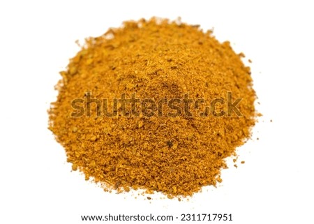 Powdered cajun spice isolated on white background. Dried ground cajun powder spices. Close up Royalty-Free Stock Photo #2311717951