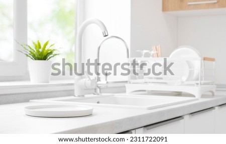 White round tray for products display on kitchen sink background Royalty-Free Stock Photo #2311722091