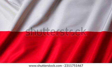 Poland national flag, folds and hard shadows on the canvas. Royalty-Free Stock Photo #2311751467