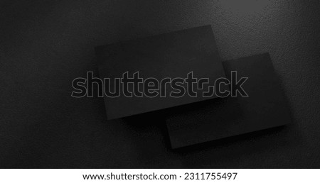 black business cards mockup over textured background. Modern style. Customizable mockup