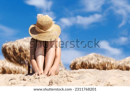 Sad Depressed Stressed Teen Girl on Beach in Bad Summer Holiday. Teenager problems. Alone Upset Unhappy Girl on Sea Beach. Royalty-Free Stock Photo #2311768201