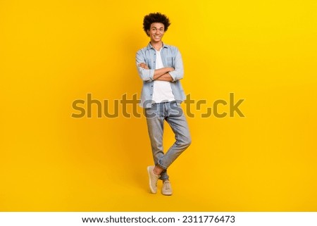 Full length photo of positive successful person crossed arms posing isolated on yellow color background Royalty-Free Stock Photo #2311776473