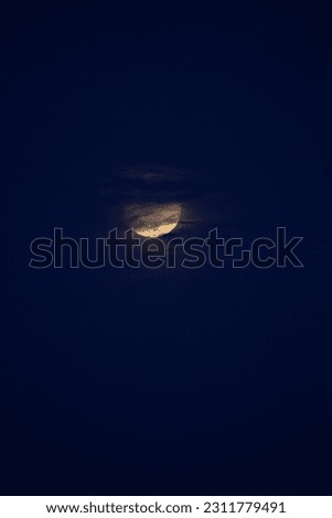 selective focus picture of the moon and clouds