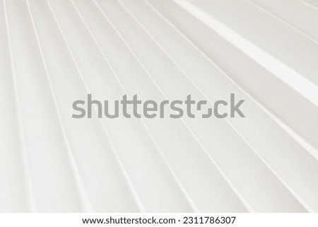 Minimalistic white dynamic background with diagonal lines, curtains, abstract dark geometric shape from fabrics with soft shadow background, top view	 Royalty-Free Stock Photo #2311786307