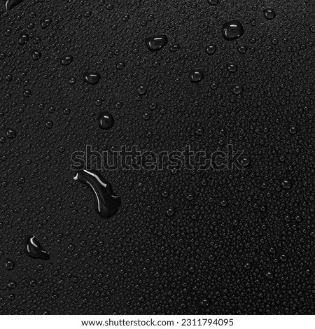 Water droplets on a black background.
