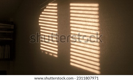 Sun light through blindings in a interior wall