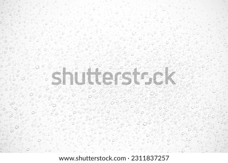Water droplets on a white background.