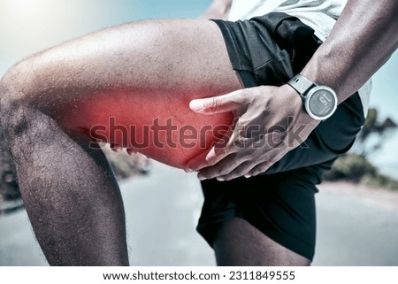 Fitness, thigh and injury with a sports man holding his muscle in pain while outdoor for a workout. Exercise, anatomy and accident with a male athlete feeling strain while training for recreation Royalty-Free Stock Photo #2311849555