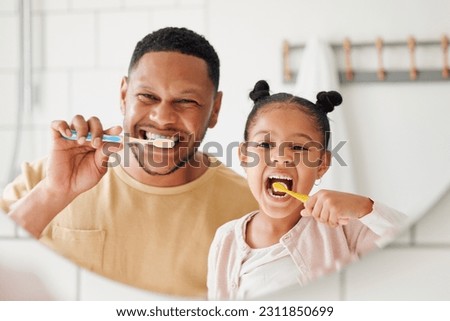 Child, father and brushing teeth in a family home bathroom for dental health and wellness in a mirror. Face of african man and girl kid learning to clean mouth with a toothbrush for oral hygiene Royalty-Free Stock Photo #2311850699