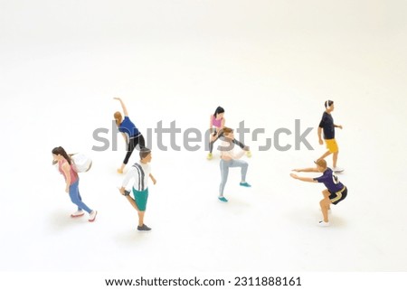 a figure warming up while doing stretching exercises Royalty-Free Stock Photo #2311888161