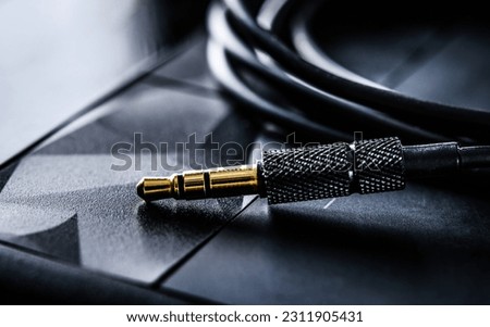 audio mini jack connector and wires close up view Royalty-Free Stock Photo #2311905431