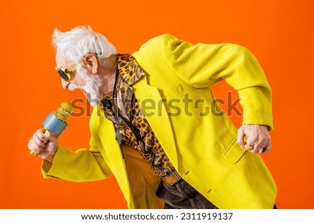 Cool senior man with fashionable clothing style portrait on colored background - Funny old male pensioner with eccentric style having fun Royalty-Free Stock Photo #2311919137