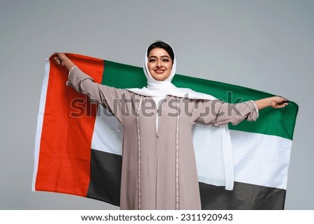 Beautiful arab middle-eastern woman with traditional abaya dress in studio - Arabic muslim adult female portrait in Dubai, United Arab Emirates Royalty-Free Stock Photo #2311920943