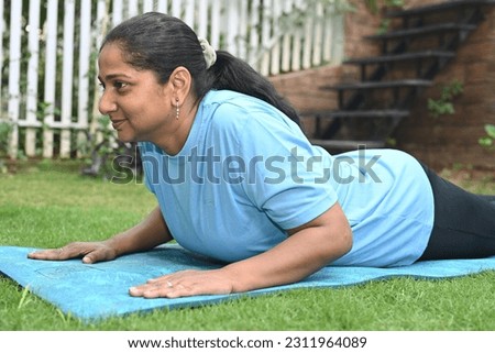 Portrait of an Indian woman doing exercise in park