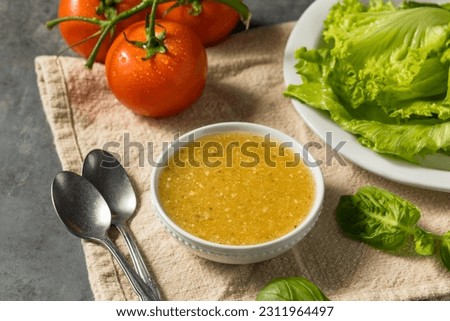Organic Homemade Italian Salad Dressing with Garlic and Oil Royalty-Free Stock Photo #2311964497
