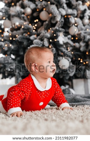 Baby on the background of a Christmas tree