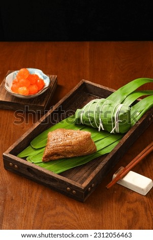 zongzi, rice dumplings,Made with glutinous rice and meat or egg yolk, wrapped in zong leaves, a common food for the Dragon Boat Festival in Asian countries.