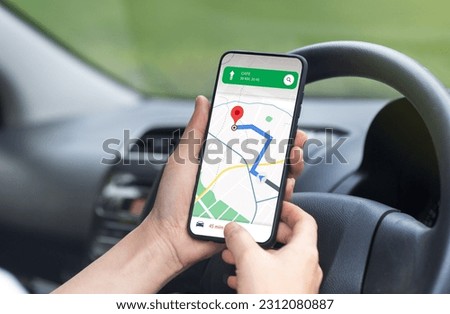 woman driving a car using a mobile phone application to search for maps route road highway Transportation concept.