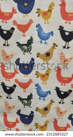 Fabric with a colorful chicken and rooster pattern all over it. 