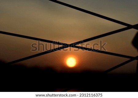 close up bicycle spokes on golden sunrise sky scene as PowerPoint template 