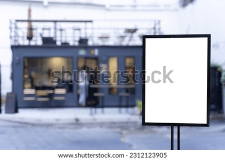 Displayed in front of restaurants, coffee shop promotion information for marketing announcements and details. Blank banners, white papers or white promotional posters. 