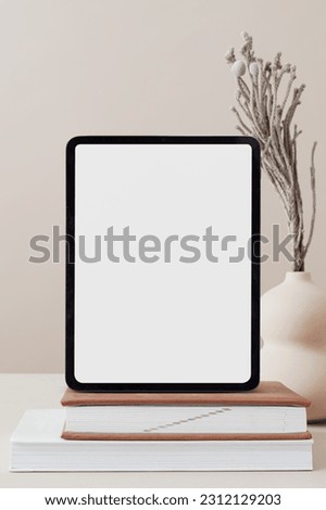 Aesthetic digital tablet and books, empty white screen, empty mock to fill, JPG high quality image