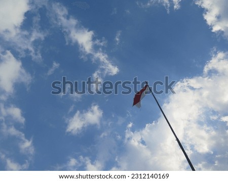 Indonesia Flag in Clear Blue Sky