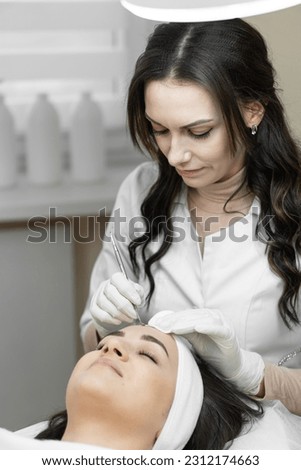 The photo demonstrates the skills and care of a professional cosmetologist who conducts deep cleansing of the skin, focusing on the individual needs of each client in a beauty salon