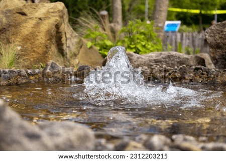 A small fountain in the sauerlandpark hemer on a spring day