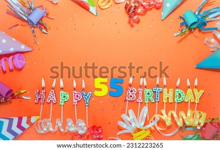 Top view birthday background with number  55. A beautiful holiday postcard on a colorful background with decorations. Anniversary congratulations with a number. Words from candles birthday.