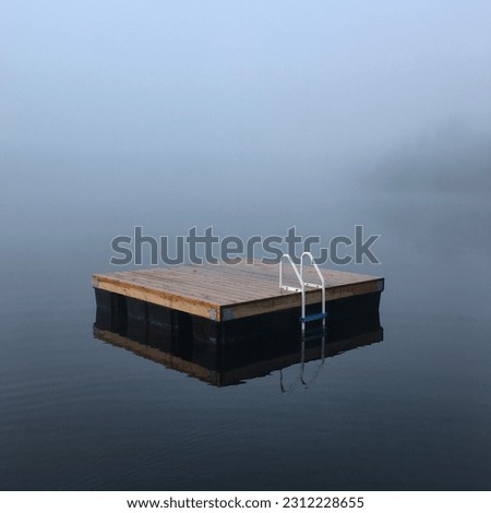 Floating dock on Canadian waters Royalty-Free Stock Photo #2312228655