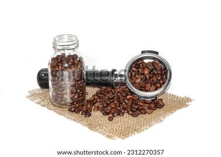 Coffee beans spread on the sack ,put coffee beans to budget coffee,bottle coffee beans,concept isolated picture.copy space or background.