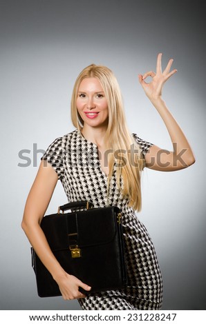 Businesswoman in business concept  with briefcase