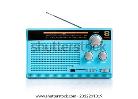 Retro old blue radio receiver with antenna isolated on white background, clipping path Royalty-Free Stock Photo #2312291019